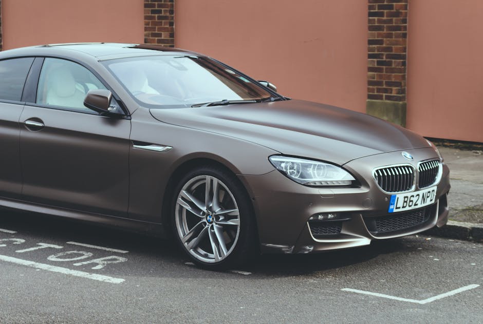 Luxury BMW 6 Series coupe parked on an urban street.