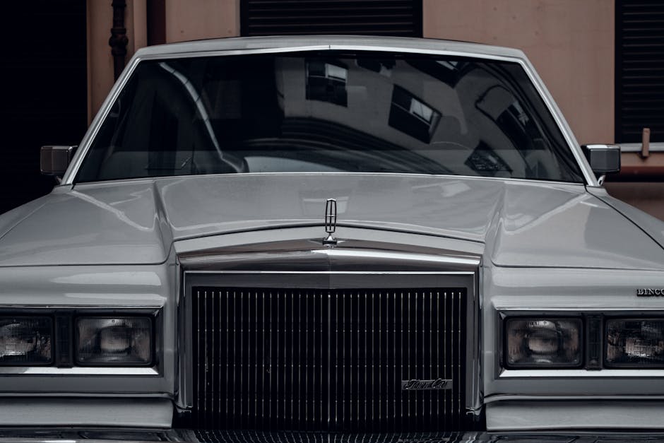 Front view of a classic Lincoln Continental Mark V in silver, showcasing vintage style and elegance.
